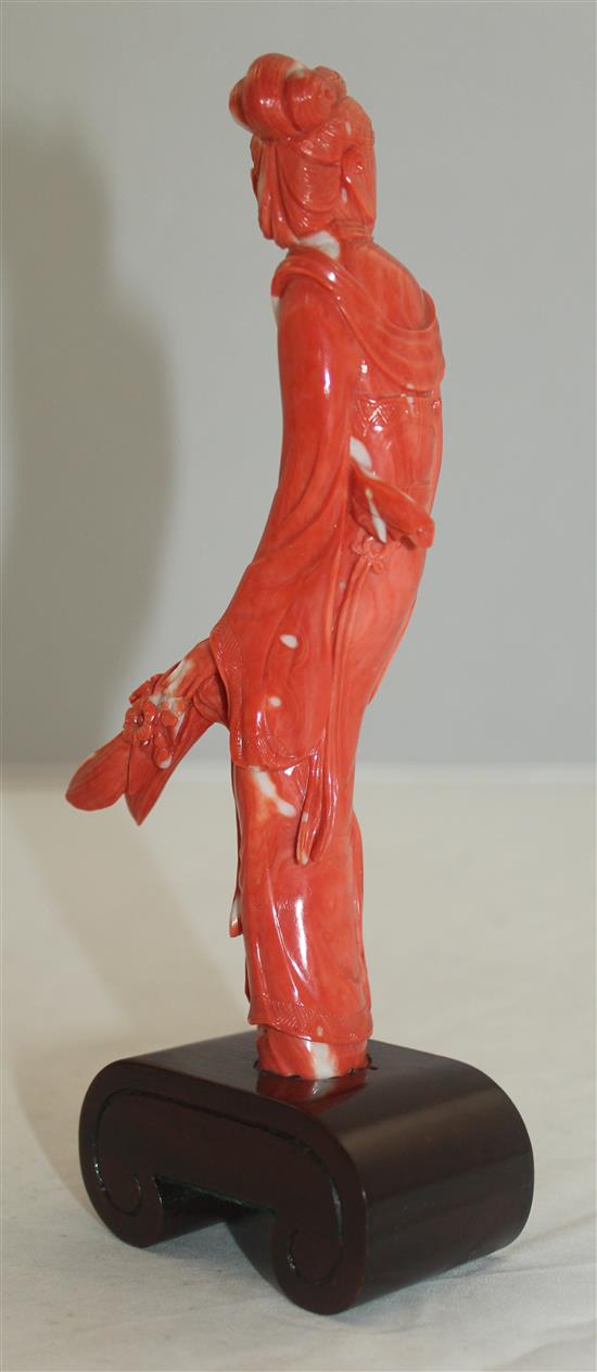 A Chinese coral figure of a beautiful lady, 20cm incl. wood stand